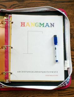 an open notebook with the word hangman written on it