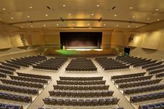 an empty auditorium filled with lots of seats