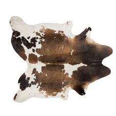 a brown and white cowhide rug on a white background