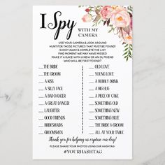 the i spy game with pink flowers on white paper next to a marble table top