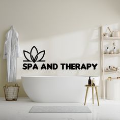 there is a bathtub with the words spa and therapy written on it in black