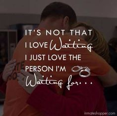 a man and woman hugging each other with the words it's not that i love waiting