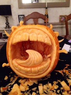 a pumpkin carved to look like a monster's mouth