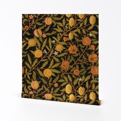 an orange tree with leaves and flowers on a black background is featured in this image