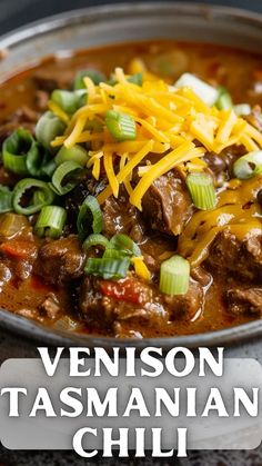 a close up of a bowl of food with text overlay that reads, venison tasmanian chili