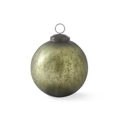 an old fashioned metal ball ornament on a white background with clippings