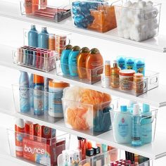 the shelves are filled with different types of bath products and toiletries in plastic bins