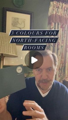 a man holding up a piece of paper with the words 3 colours for north - facing rooms