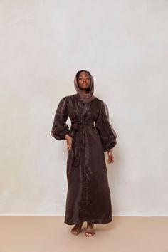 The Organza Abaya is statement outfit for any event. It's super lightweight yet so simple with the prettiest sheen. Complete the look with our matching long sleeve satin slip dress and a pair of strappy heels for a luxe finish or make it into a more casual look. Model is wearing a size Small Model Measurements: Height 5'8. Waist 25", Bust 32", Hips 37" *Please note that the color displayed in the picture might be slightly different due to the color resolution and lighting. Fabric Description & C Elegant Silk Abaya For Eid, Elegant Silk Abaya With Long Sleeves, Silk Long Sleeve Abaya For Party, Silk Long Sleeve Party Abaya, Formal Long Sleeve Silk Abaya, Elegant Long Sleeve Silk Abaya, Organza Abaya, Lighting Fabric, Statement Outfit