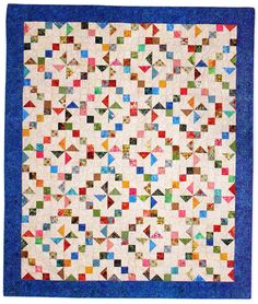 a quilt with many different colors on it