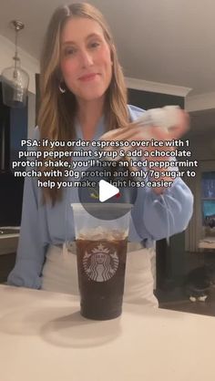 a woman holding a cup of coffee in front of her face with the caption