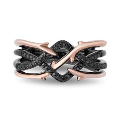 a black and rose gold ring with diamonds