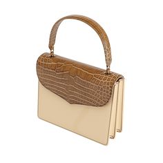 Isabella is crafted in natural vegetable-tanned leather with an authentic alligator flap, exuding classic elegance and modern flair. This versatile handbag features high-quality Natural Vachetta for the main body, gussets, and back body, offering a luxurious and timeless appeal. The Cafe Glossy alligator top flap adds a distinctive touch, giving it a sophisticated and exotic look that stands out. Handcrafted by generational artisans, Isabella is designed to seamlessly transition from day to night, making it the perfect companion for any occasion. Luxury Leather Structured Flap Bag, Luxury Leather Trim Flap Bag, Luxury Timeless Textured Leather Flap Bag, Chic Luxury Flap Bag With Brass Hardware, Luxury Textured Leather Timeless Flap Bag, Tan Handbags, Body Top, The Cafe, Leather Conditioner