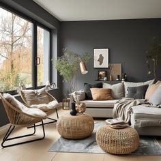 a living room filled with lots of furniture next to a large window and wooden floors