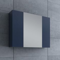 a blue and white wall mounted cabinet against a gray wall