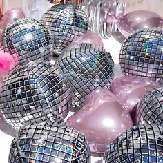 many shiny disco balls are stacked on top of each other