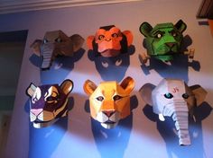 there are many paper animals on the wall