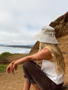 "A sun hat for beach days and summer fun. This sun hat for women has a nice wide brim to protect your whole face and even your neck and chest. A drawstring around the head keeps the hat fitting snug. Easy to bring along in your bag, folds up easy. This hat is made from a medium weight homespun linen and cotton blend fabric in a neutral beige color. Inside liner is white cotton. I used a stiff interfacing for brim to keep it's shape. Brim measures 4.5\" Crown depth is 3.5\". Contact me for custom Beach Hats Outfit, Australian Hat, Custom Fitted Hats, Wide Brim Sun Hat, Sun Hats For Women, Sunny Beach, Hat For Women, Neutral Beige, Beauty Clothes