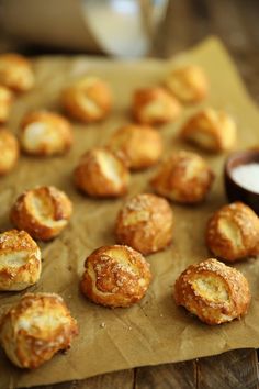 small pastries sitting on top of a piece of wax paper