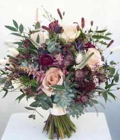 a bouquet of flowers sitting on top of a table