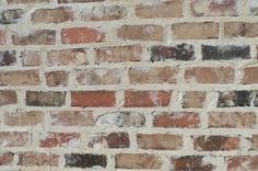 an old brick wall is shown in this image