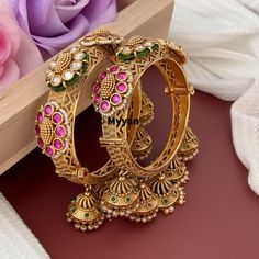 Ruby kundan Kada bangle with jhumka. Inspire your style with traditional rajwadi kada handcrafted from premium quality kundan, stone and pearl to create elegant piece of jewelry from our Indian wedding collection.   All orders Ship same day if placed before 4:00 PM EST Create beautiful memory for any occasion with elegant jewelry for your loved ones You will receive carefully packaged items in jewelry box, ready to give memorable gift  to your Wife, mother, sister  friend or collegue. All orders Navratri Wedding Bracelet Jewelry, Temple Jewelry Bangle For Wedding And Navratri, Temple Jewelry Openable Chandbali, Wedding Bangle For Diwali, Heavy Bridal Bangle Sets For Festive Occasions, Wedding Diwali Bangle With Latkans, Wedding Bangle With Latkans For Diwali, Cutdana Kundan Bangle For Wedding, Kundan Cutdana Bangle For Wedding