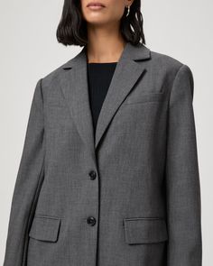 This versatile oversized blazer is the perfect year-round jacket. Crafted from a double weave stretch suiting material in charcoal grey, the Sarto Blazer is designed with double welt and flap pockets at the front and two front horn button closures. | Sarto Blazer - Charcoal | Size 2 Gray Fall Workwear Suits, Gray Notch Lapel Blazer For Work, Gray Lapel Collar Sport Coat For Work, Gray Sport Coat With Lapel Collar For Work, Gray Fall Suits For Work, Gray Blazer With Suit Collar For Work, Gray Suit Collar Blazer For Work, Gray Suits For Fall Workwear, Gray Workwear Blazer With Pressed Crease