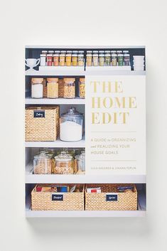 the home edit book is open to reveal an organized pantry with baskets, jars and other items