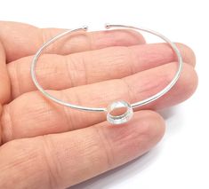 Material : Sterling Silver, 925 Silver Color: Silver Quantity : 1pc  Size: Adjustable Bezel size : 8mm round To see other all 925 Sterling Silver Bracelet Blanks please click below https://www.etsy.com/shop/AZsupplies?search_query=sterling+silver+bracelet+blank To see other all 925 Sterling Silver Rings please click below https://www.etsy.com/shop/AZsupplies?search_query=sterling+silver+ring+blank To see other all 925 Sterling Silver Pendant bezel please click below https://www.etsy.com/shop/AZsupplies?search_query=sterling+silver+pendant+blank To see other all 925 Sterling Silver Findings please click below https://www.etsy.com/shop/AZsupplies?ref=seller-platform-mcnav&search_query=sterling+silver+findings To see other all 925 Sterling Silver please click below https://www.etsy.com/shop/A Round Bangle With Bezel Setting As Gift, Round Bezel Setting Bangle Gift, Round Bezel Set Bangle As Gift, Gift Round Bangle With Bezel Setting, Bracelet Blanks, Silver Gift Wrap, Silver Gifts, Sterling Silver Bracelet, How To Make Earrings