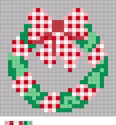 a cross stitch christmas wreath with red, green and white squares