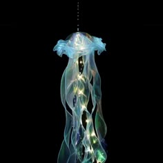 a light up jellyfish hanging from the ceiling