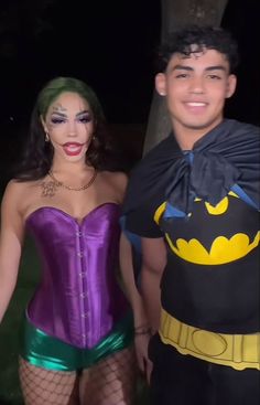 a man and woman dressed up in costumes