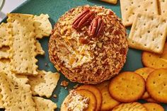 an assortment of crackers and cheeses on a plate