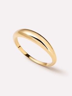 a yellow gold wedding ring on a white background