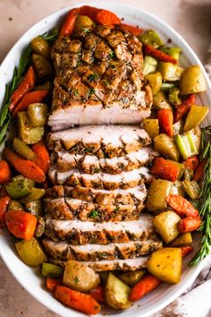 a white plate topped with meat and veggies