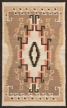 a beige and black rug with an abstract design on the center, surrounded by geometric shapes