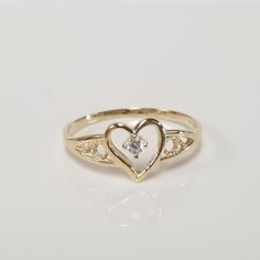 "Thanks for shopping our vintage estate store. We tend to sell well below wholesale and truly hope you enjoy all of our items. Many of the items are one of a kind, so please enjoy scrolling through the pictures and hopefully something will catch your eye. Brown spots are from camera. Estate 10k yellow gold .04ct cz diamond heart ring. Ring size: 6.75 CZ Diamond: .04ct Setting: 8mm 3/8\" Band width: 1mm Weight: 1.01 grams Very sweet ring. Marked 10k." Fine Gold Rings, Sweet Ring, Diamond Heart Ring, Baby Baptism, Rings Vintage, Jewelry Accessories Ideas, Dope Jewelry, Classy Jewelry, Jewelry Lookbook