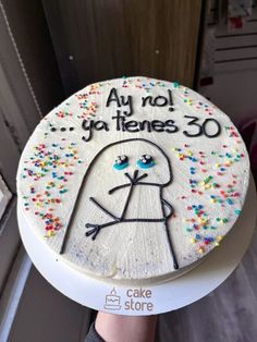 a cake that has been decorated with sprinkles and the words, au nol y'attenes 30