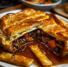 a beef pot pie on a white plate