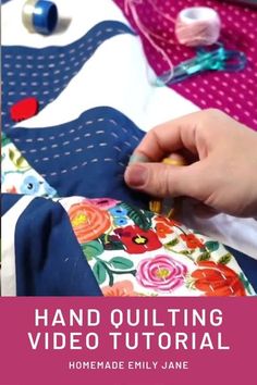 someone is sewing on a piece of fabric with the words hand quilting video tutor