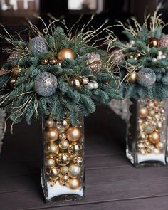 two vases filled with ornaments on top of a table