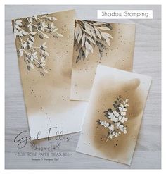 two cards with white flowers on them and the words shadow stamping written in black ink