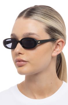 Sleek oval frames accentuate the allure of '90s-inspired sunglasses fitted with full-coverage, scratch-resistant lenses. 51mm lens width; 17mm bridge width; 140mm temple length 100% UV protection Ecozen T110 plastic Imported Le Specs Outta Love, Le Specs Sunglasses, Love Silhouette, Cat Eye Sunnies, Modern Flat, Le Specs, Oval Sunglasses, 90s Inspired, Oval Frame