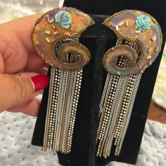 These Are True Statement Earrings From Our Store In The 80s. The Top Is A Hand Painted Pastel Metal Curl And A Lot Silver & Gold Fringe Chains Below. These Are Clip On Earrings. 1980s Approx 5” L Clip Ons Vintage Box D Nickel Free Artistic Jewelry For Parties, Artistic Nickel-free Jewelry For Parties, Nickel-free Artistic Jewelry For Parties, Unique Dangle Clip-on Earrings For Party, Artistic Dangle Jewelry For Party, Nickel Free Artistic Party Jewelry, Artistic Dangle Party Jewelry, Handmade Party Clip-on Earrings, Hand Painted Bohemian Jewelry For Parties