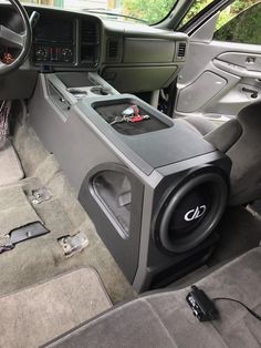 the inside of a vehicle with speakers and radio