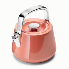 an orange kettle with a handle on it