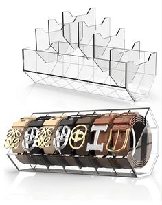 a display case with four belts in different colors and designs on the front, one for each belt