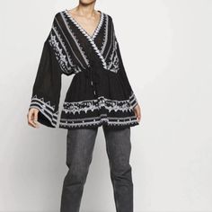 Free People Saffron Embroidered Tunic In Black Xs A Beautiful Embroidered Trim Details This Long Sleeve Boho Style Tunic By Free People. V-Neckline With Long Sleeves And A Drawstring Waist. Slips One Over Head. Size Xs And New With Tags. Retail $168. Approx. Length - 26" Shoulder To Hem Bust - 20" Armpit To Armpit 59% Cotton/41% Rayon Hand Wash Great Condition Embroidered Trim, Embroidered Tunic, Black Xs, Trim Detail, Free People Tops, Boho Style, Drawstring Waist, Black Blue, Boho Fashion