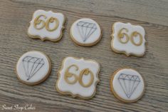 six decorated cookies with the number 60 and diamond on them