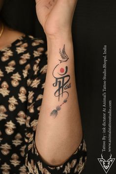 a woman with a tattoo on her arm